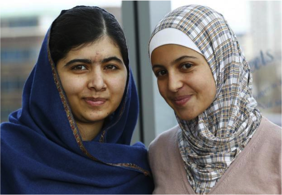 Muzoon Almellehan poses for a photo with her friend, Malala Yousafzai.